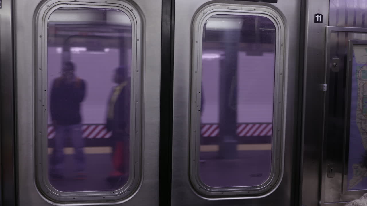 NYC Subway Train. Train leaving, view from inside train - New York City Subway. Slowmotion