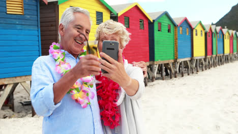 Senior-couple-taking-a-selfie-on-the-beach