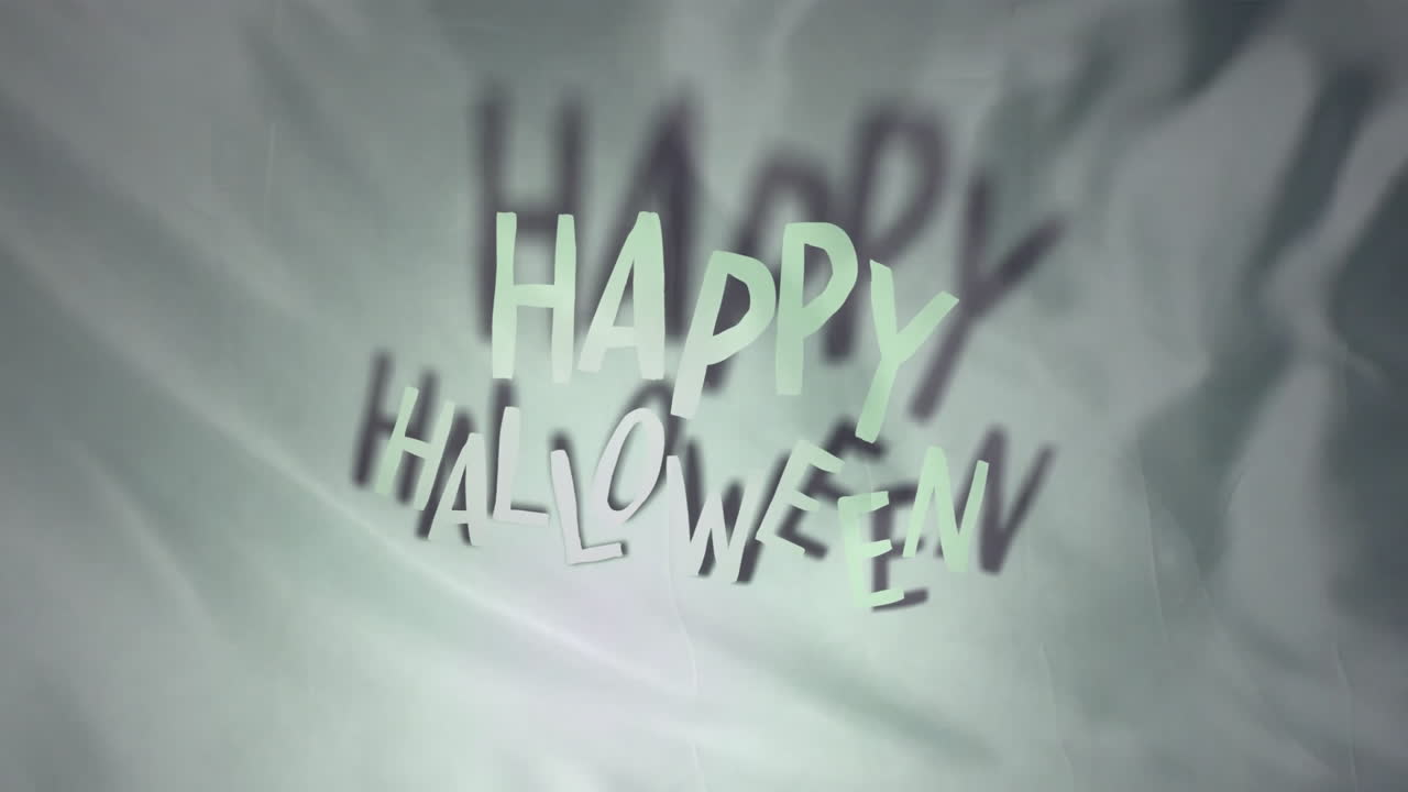 Animasjon av "Happy Halloween" over mønstret bakgrunn