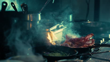 Chef-cooking-meat-and-vegetables-in-sizzling-hot-pans