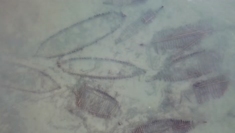 aerial view some abandoned wreck wooden boats at bottom of water