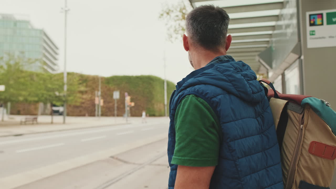 Man waiting at bus stop