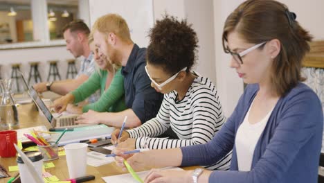 people working individually in office