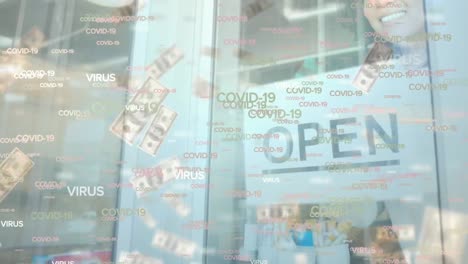 animation of floating covid-19 words and falling banknotes over happy mixed race female chef