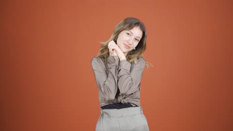 The-young-woman-making-cute-gestures-for-the-camera.