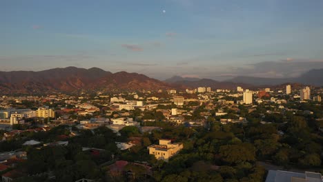 Aerial-shot-of-Santa-Marta,-Colombia-with-buildings-and-mountains