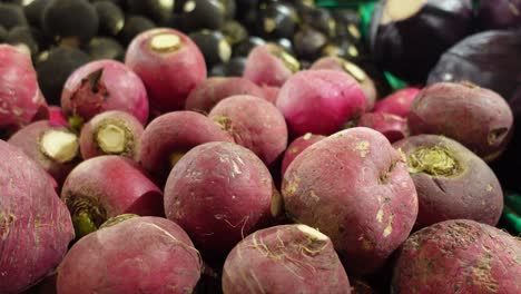 pile of red radishes at a grocery store