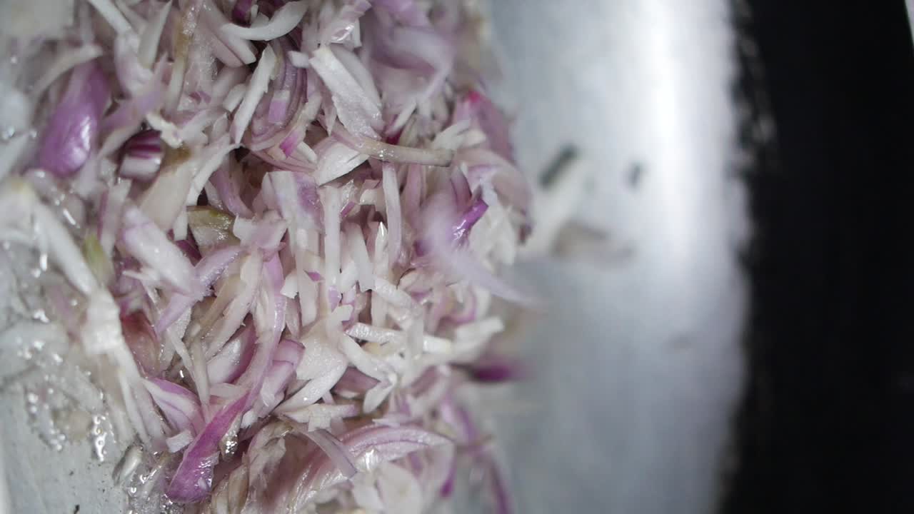 Sliced Onions Frying in a Pan