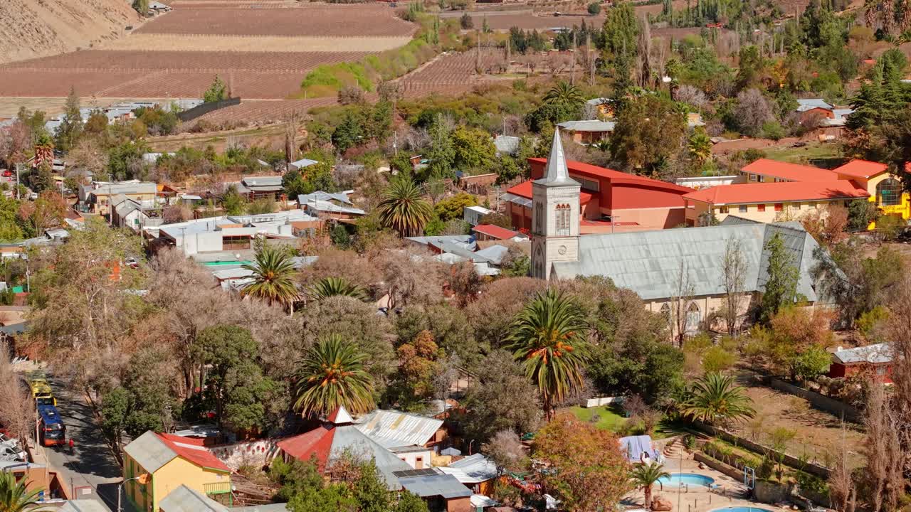 Scenic Pisco Elqui in Elqui Valley features vineyards, clear skies, observatories, and historic church