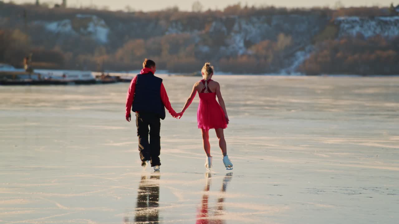 Couple Ice Skating on a Frozen Lake