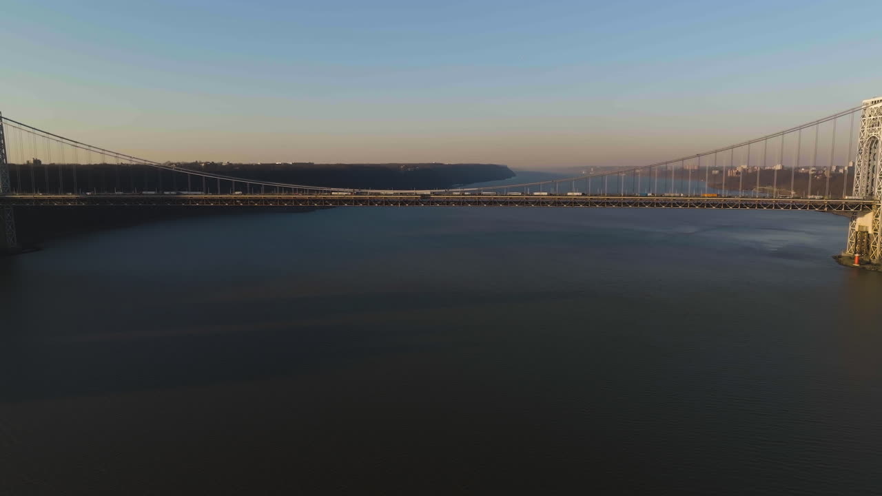 Drone shot towards the George Washington bridge, sunny evening in New York, USA