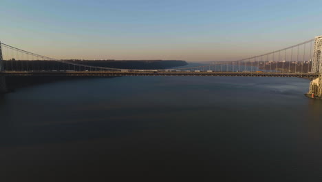 Drone shot towards the George Washington bridge, sunny evening in New York, USA