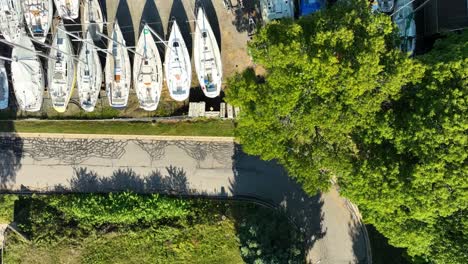 Dolly-motion-from-street-to-Sailboats-lined-up