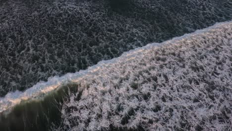 ocean and rolling giant waves with white foam