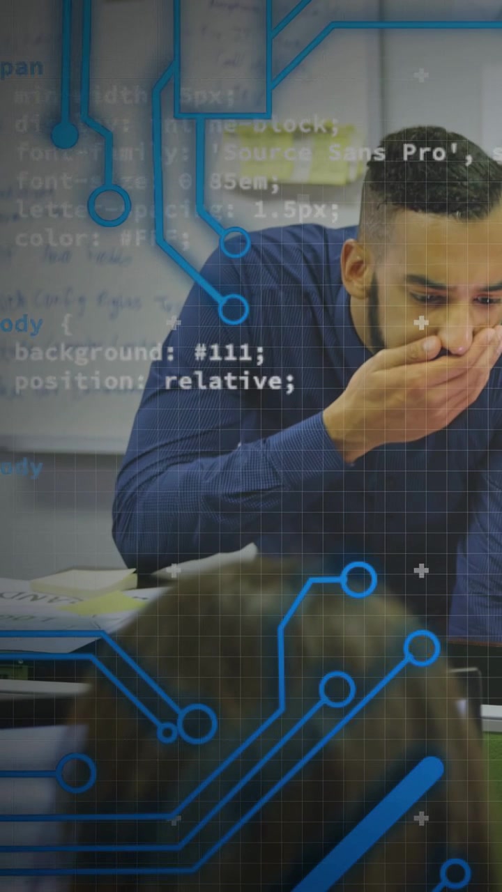 Vertical video: Teacher studying notes for class, hand to mouth while edtech overlay on board