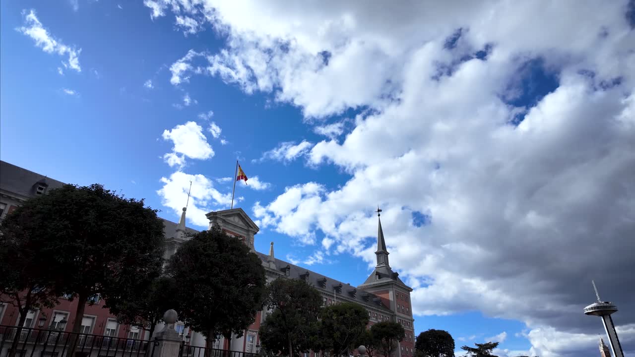 Static shot with the Spanish Air and Space Force Headquarters building in the foreground and the Faro de Moncloa in the background, in Madrid, Spain