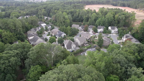 aerial reveals cute suburban neighborhood, middle class families, single family homes