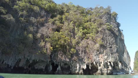 Wide view of canoeing towards stalactites at Hong Island, Thailand.
