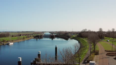 Aerial:-The-locks-of-the-Canal-through-Walcheren,-near-the-historical-town-Veere