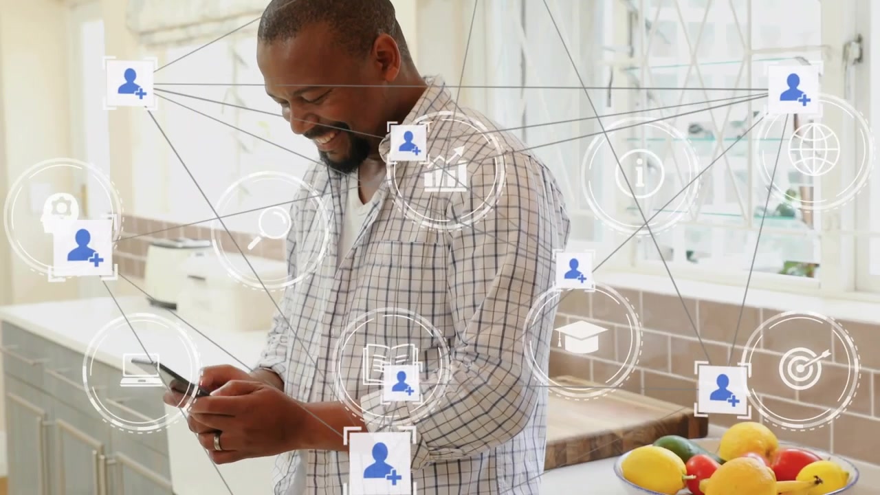 Mid adult man tapping phone, tap sparking network icons expanding, showing contacts and messages
