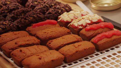 artezan bread with red strawberry jam on top, fresh bake double chocolate banana artesian bread in bakery shop close-up. artisan bread is making by skill bakers using natural and high-quality ingredients. food with health and flavour benefits. sweet breads for dessert and breakfast