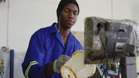 mixed race man working in factory