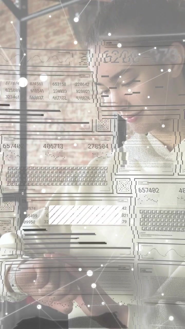 Vertical video: Woman looking at wrist tapping watch starting AR overlay and seeing IT data in loft