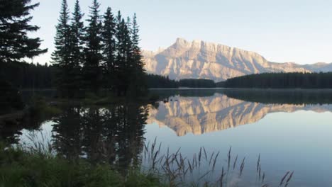 mount rundle and two jack lake with early morning mood and mountain reflection