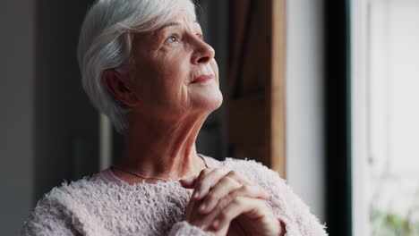 Senior-woman,-face-and-thinking-by-window