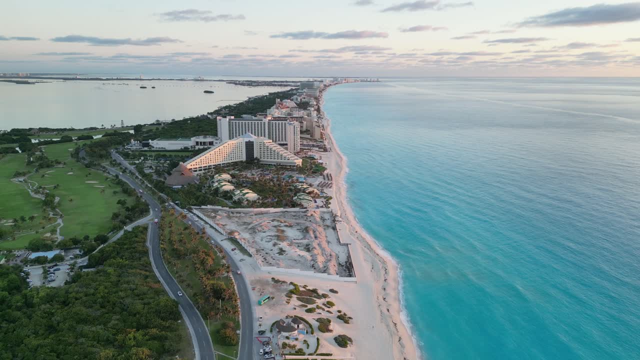 Cancun’s coastline, clear turquoise water, and beach resorts, aerial view, playa delfines