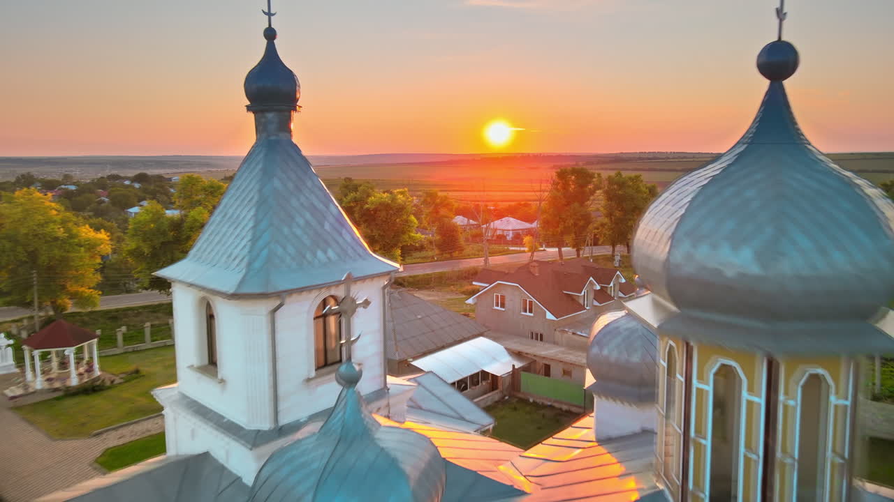 Aerial drone view of a church at sunset. Village in Moldova
