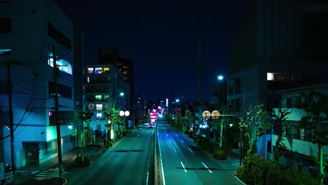 a night timelapse of the traffic jam at the downtown street in tokyo wide shot