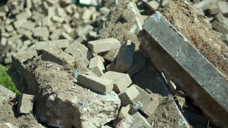 consequences of russia's military invasion of ukraine a destroyed residential building after artillery strikes on residential house piles of bricks, remains of the walls - close-up