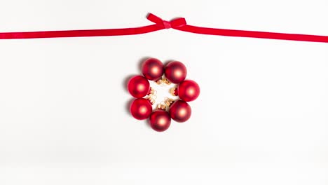 red ribbon bow at the top and red evening balls. christmas concept
