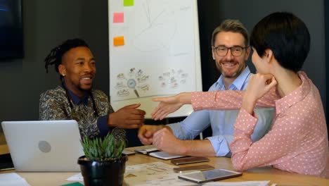 happy business executives shaking hands in conference room 4k