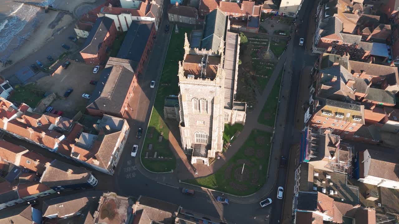 Historic church in Cromer, Norfolk, surrounded by streets and rooftops near the coast