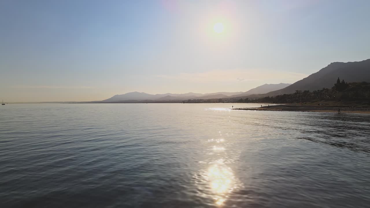 Aerial backwards movement over the sea
