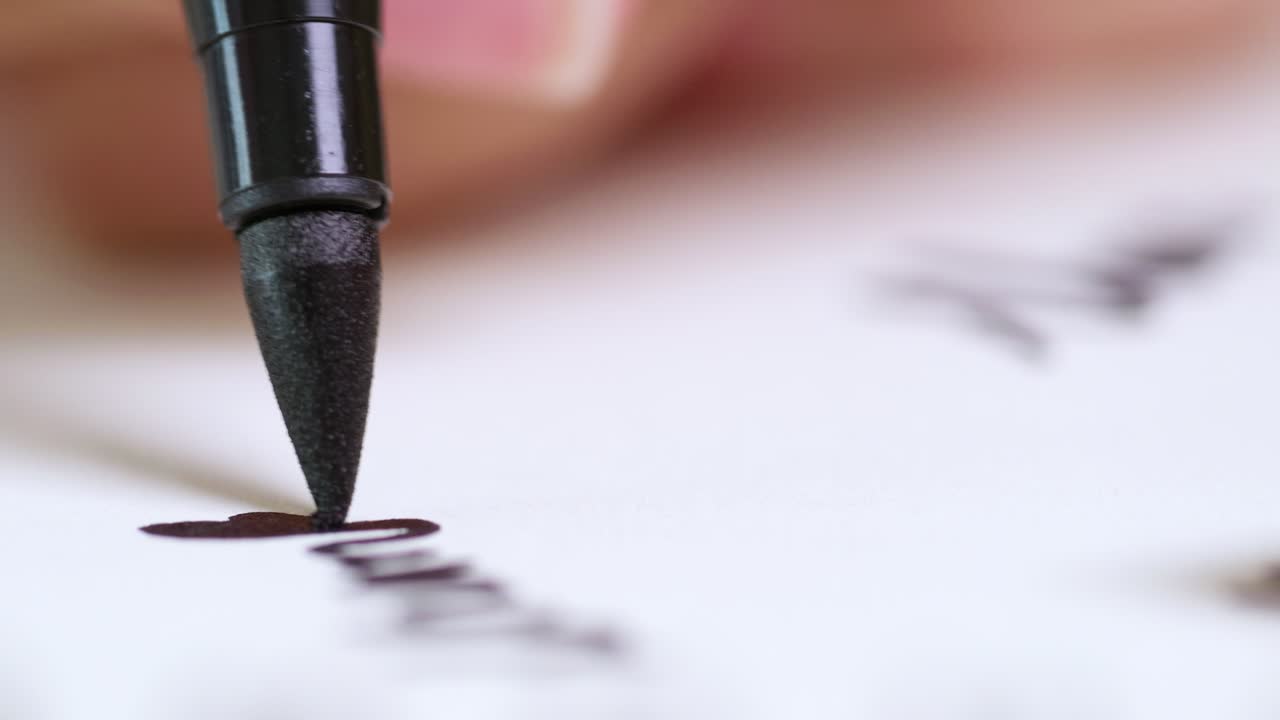 A close-up view of a marker poised to write capturing the essence of creativity