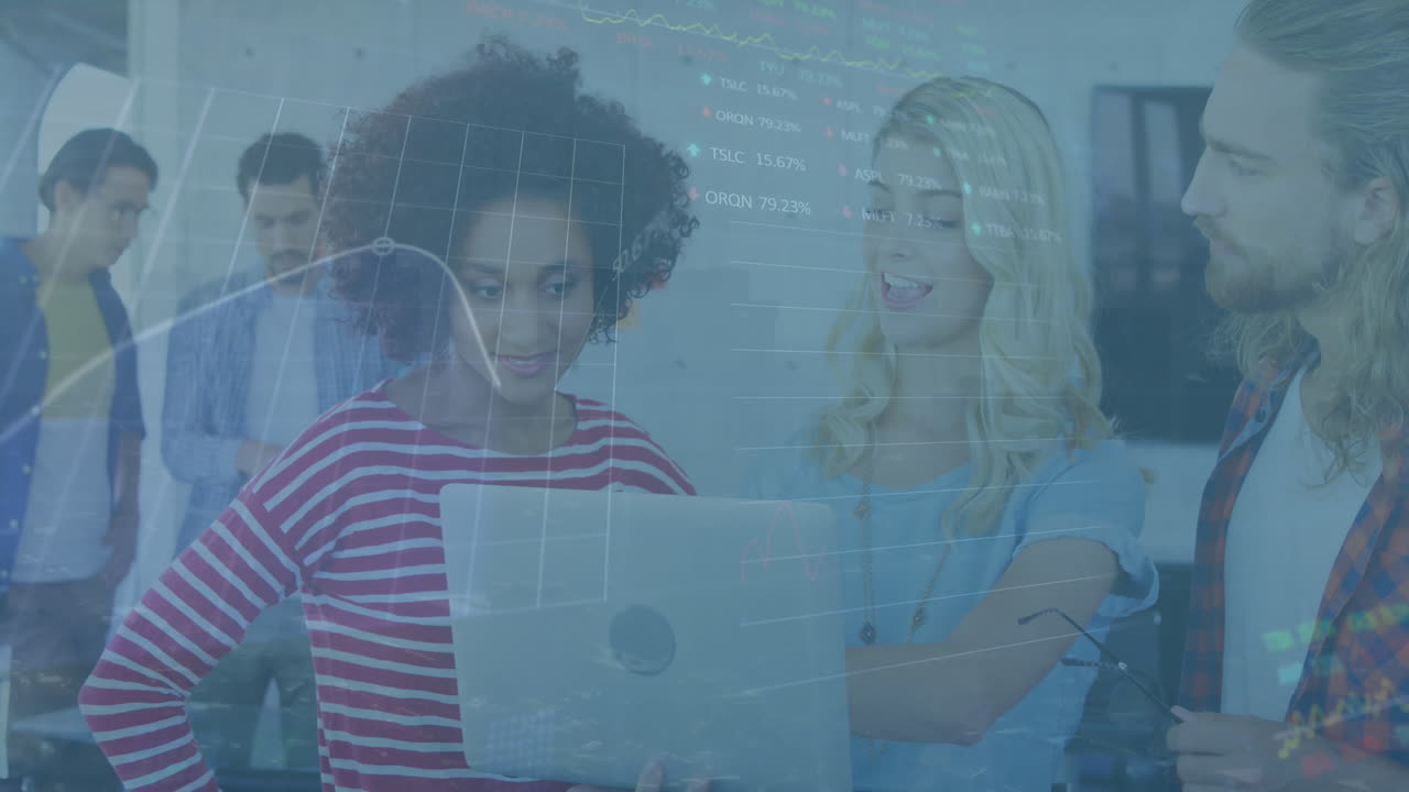 Animation of financial data processing over diverse business people using laptop at office