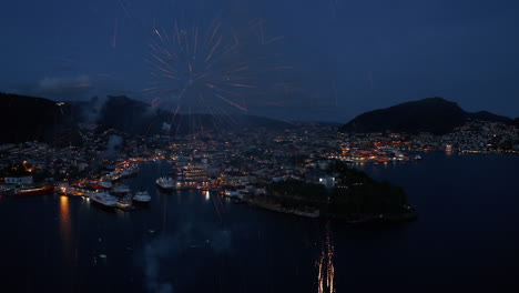 beautiful aerial shot of fireworks over bergen, norway on the constitution day may 17