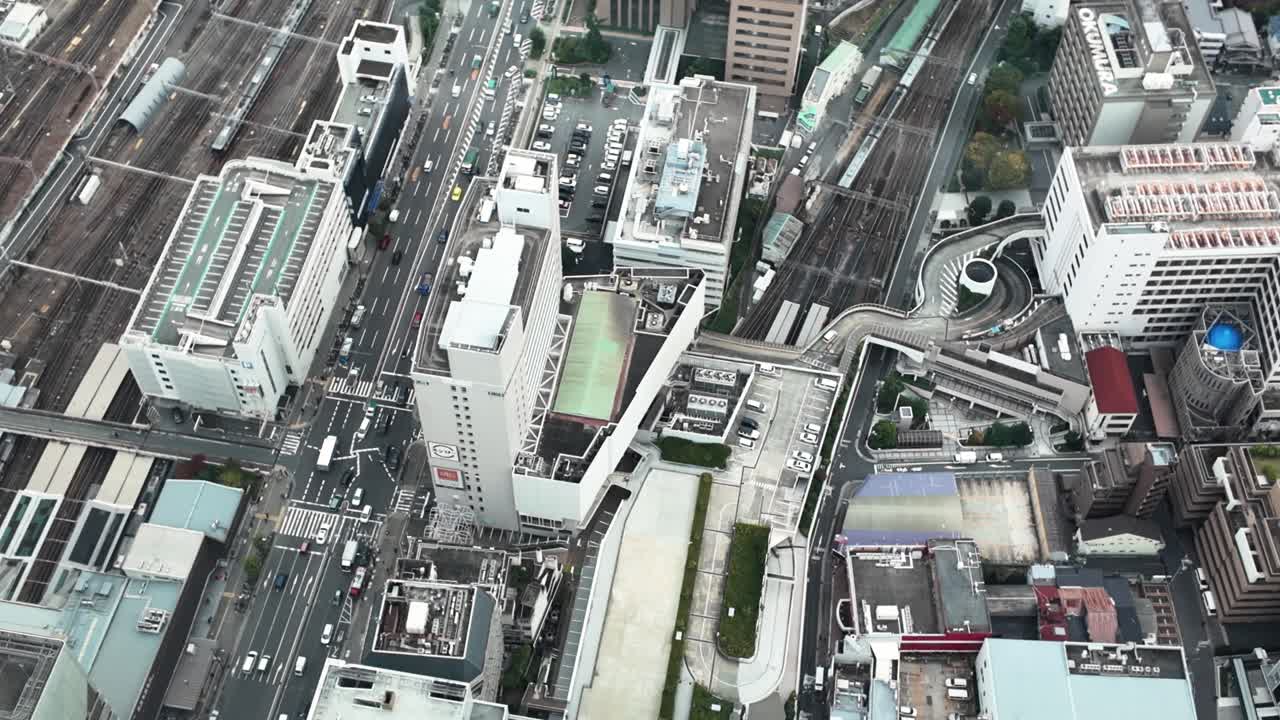 High angle view of Osaka, Japan, featuring buildings, transportation infrastructure, and urban landscape