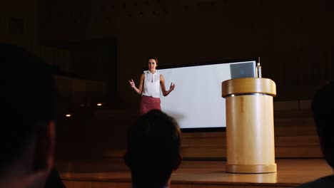 Audience-applauding-speaker-before-conference-presentation