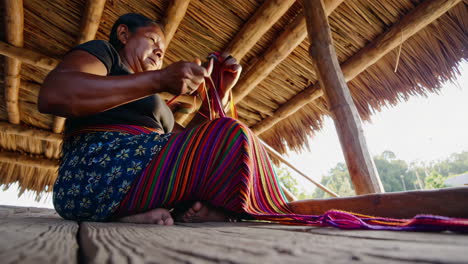 woman weaving traditional textile