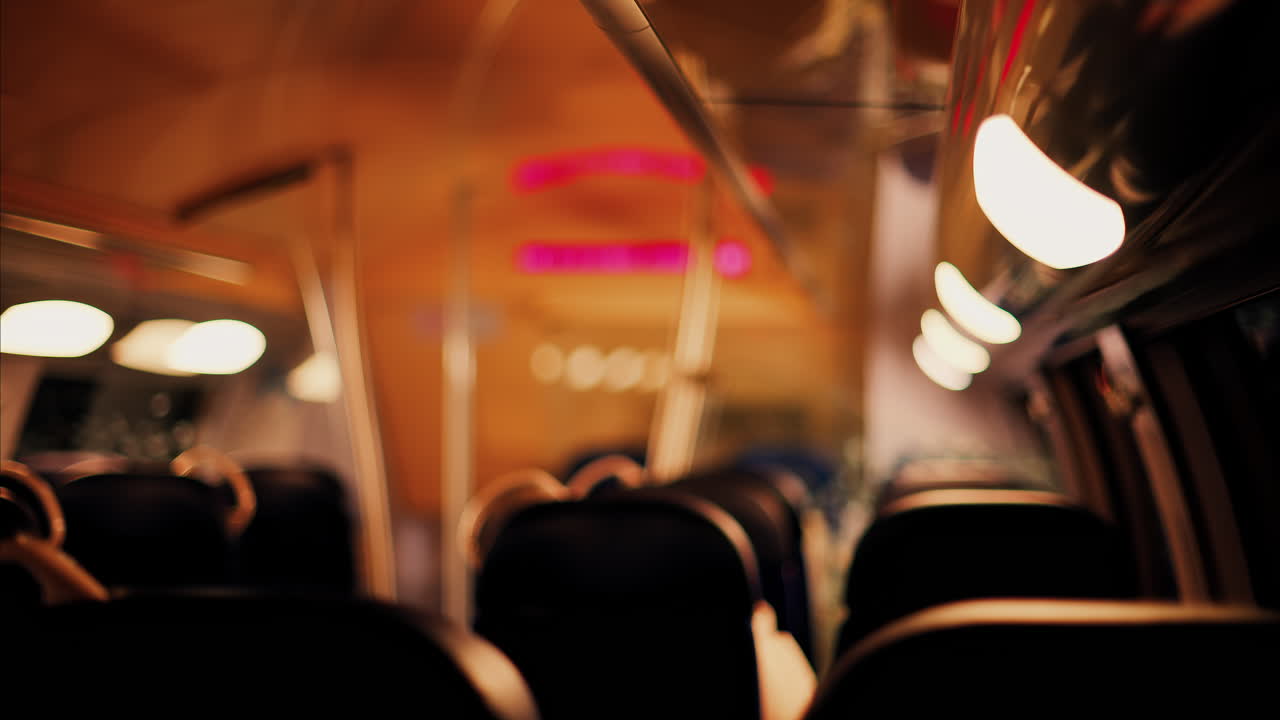 Blurred view of the seats near the window of a moving train