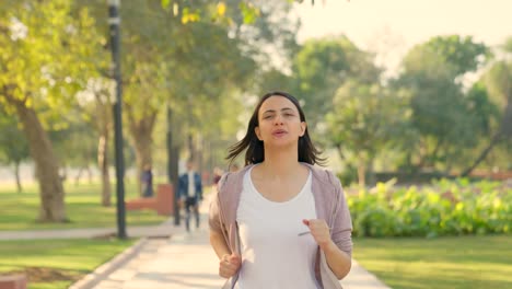 Indian-girl-running-in-a-park-in-morning-time