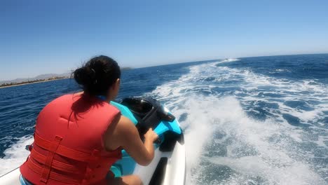 person riding a jet ski on the ocean