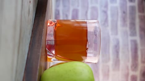 apple juice in glass with apple