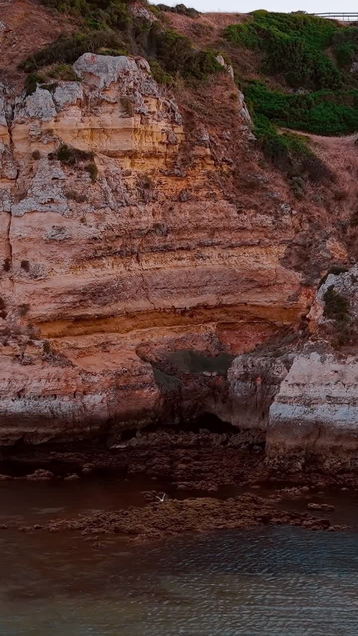 Rocky coastline and clear water in Portugal during the evening
