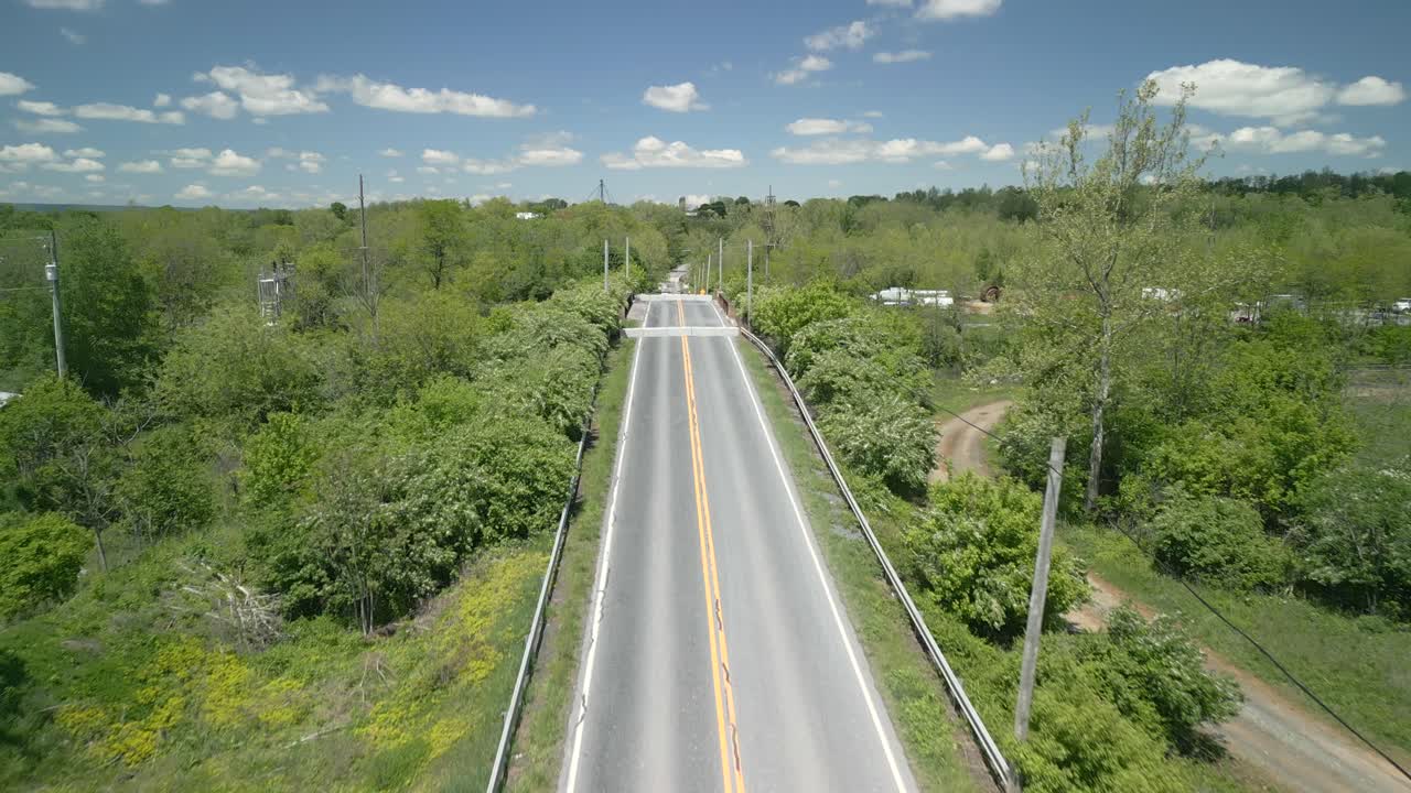 Aerial drone view of a bridge going over a railway.