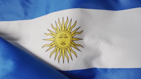 Animation-of-football-over-flag-of-argentina-with-copy-space